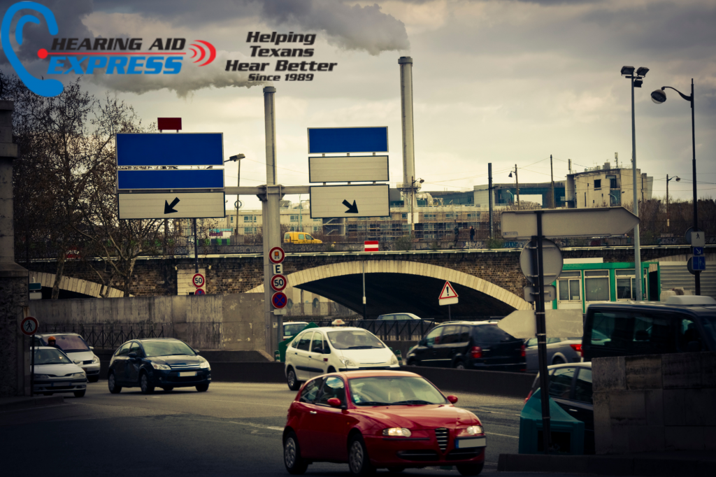 cars and a factory with air pollution