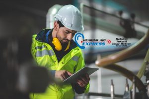 worker looking at a clipboard