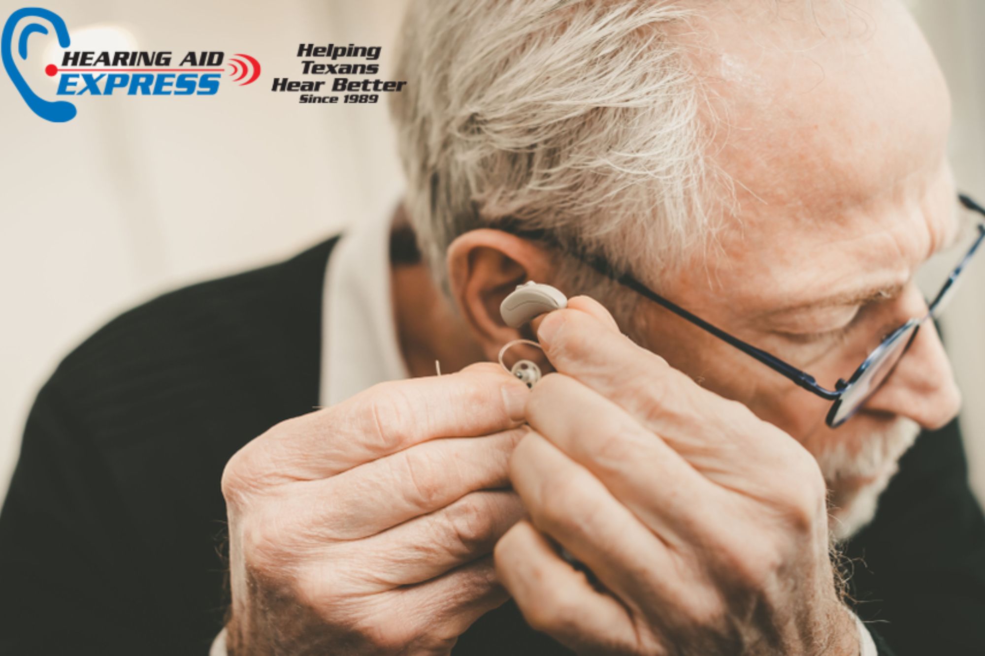 man putting in hearing aid